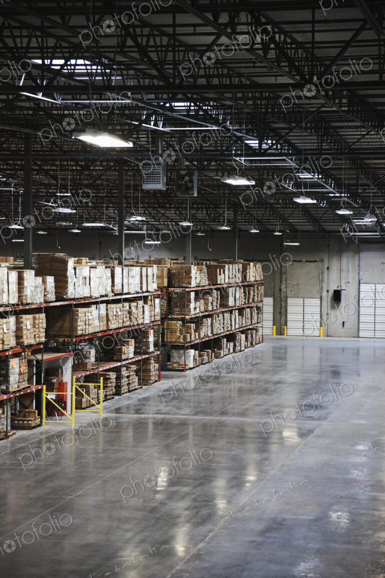 Cardboard boxes on shelves in warehouse