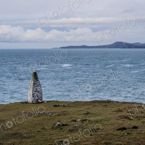 Cardigan Bay and stone cairn marking the entrance to Porthgain Harbour
