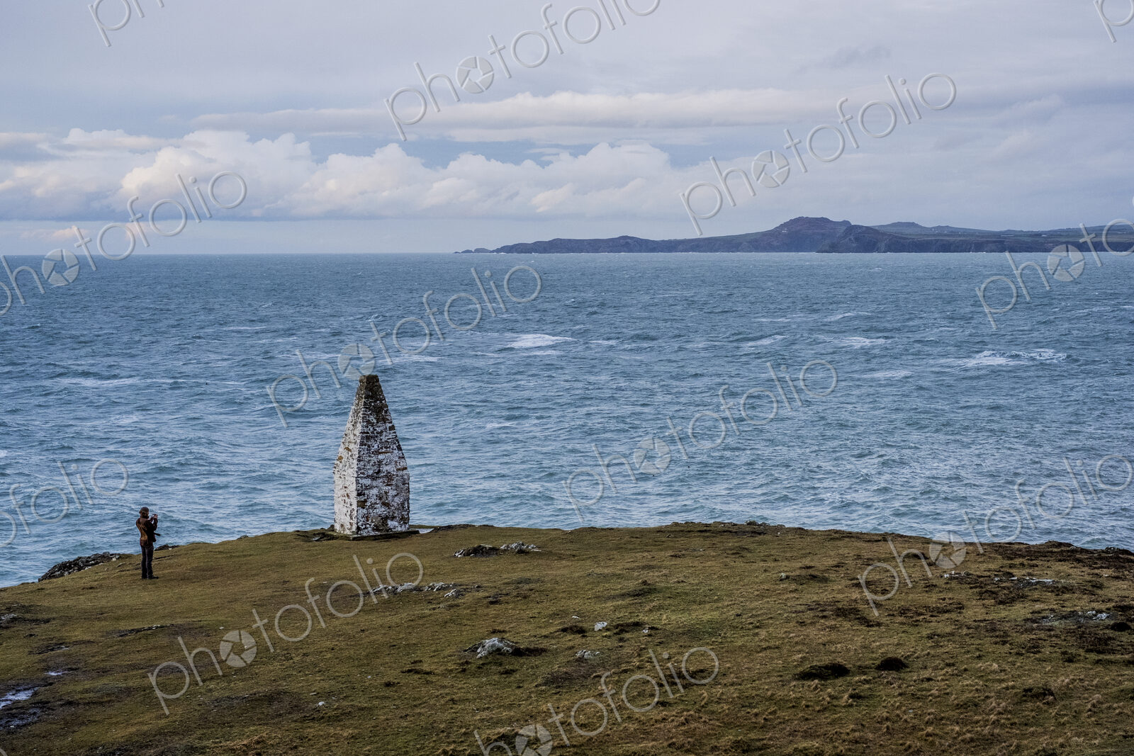 Cardigan Bay and stone cairn marking the entrance to Porthgain Harbour