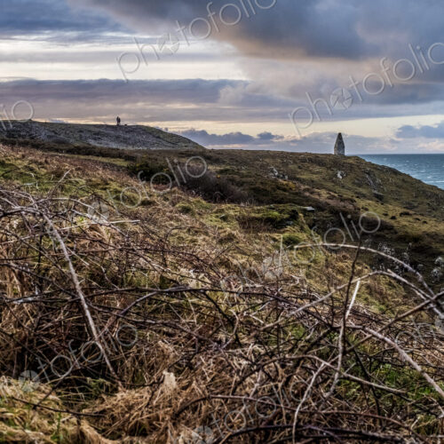 Cardigan Bay with distant stone cairn marking the entrance to Porthgain Harbour