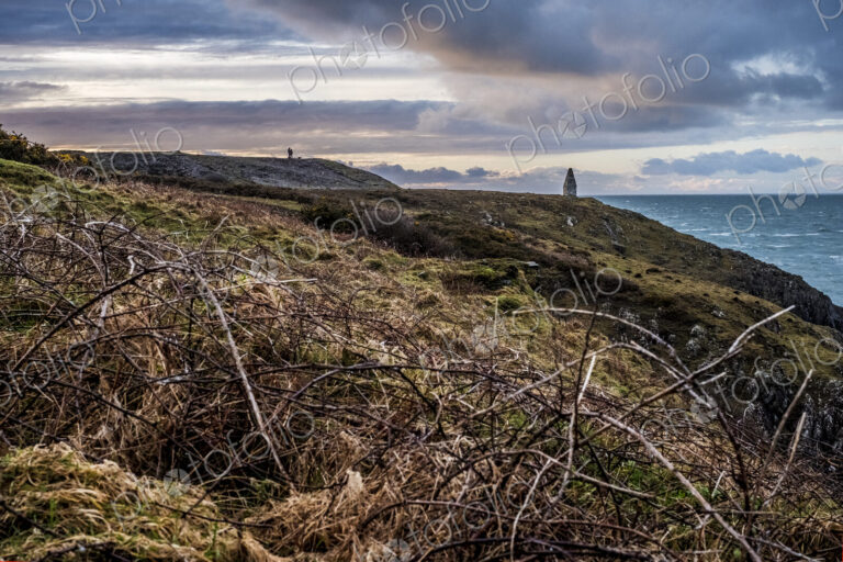 Cardigan Bay with distant stone cairn marking the entrance to Porthgain Harbour