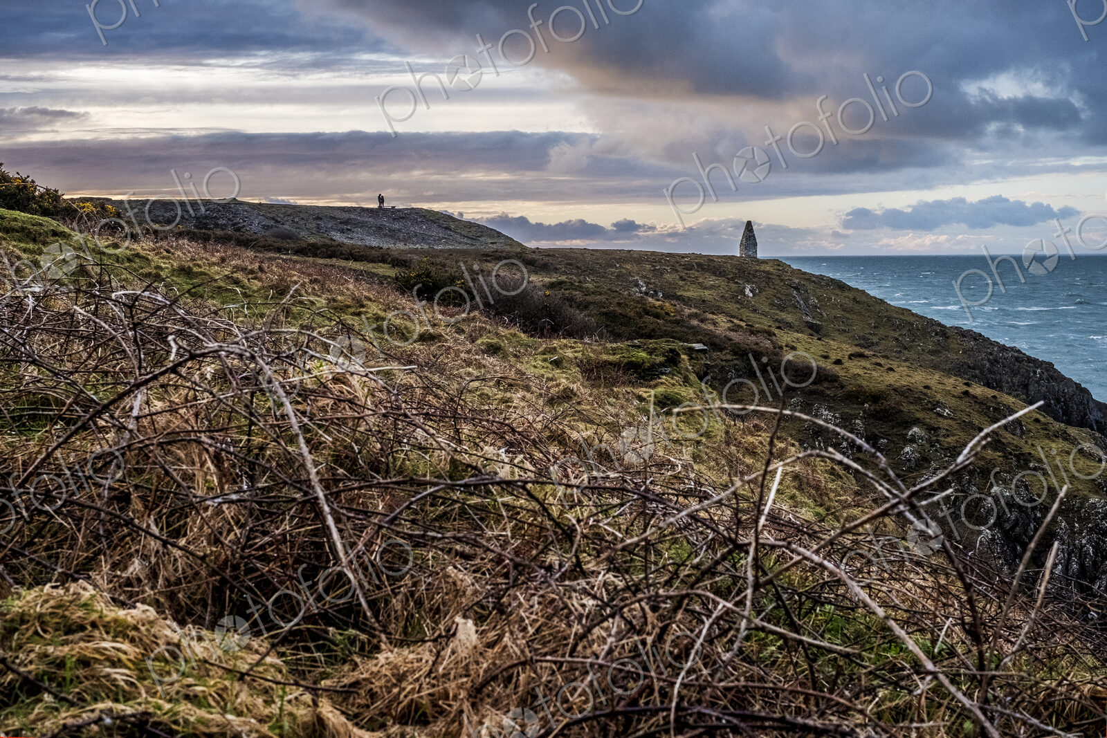 Cardigan Bay with distant stone cairn marking the entrance to Porthgain Harbour