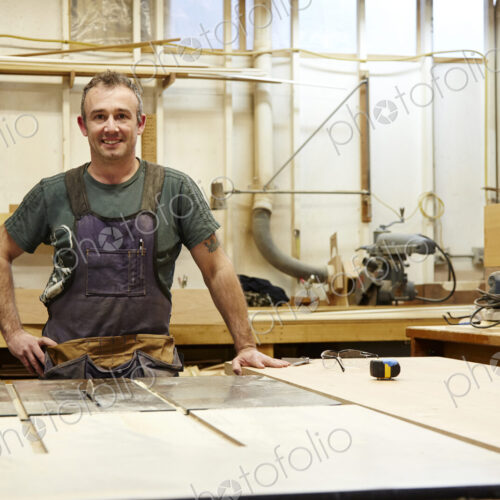 Carpenter smiling in workshop Carpenter smiling in workshop