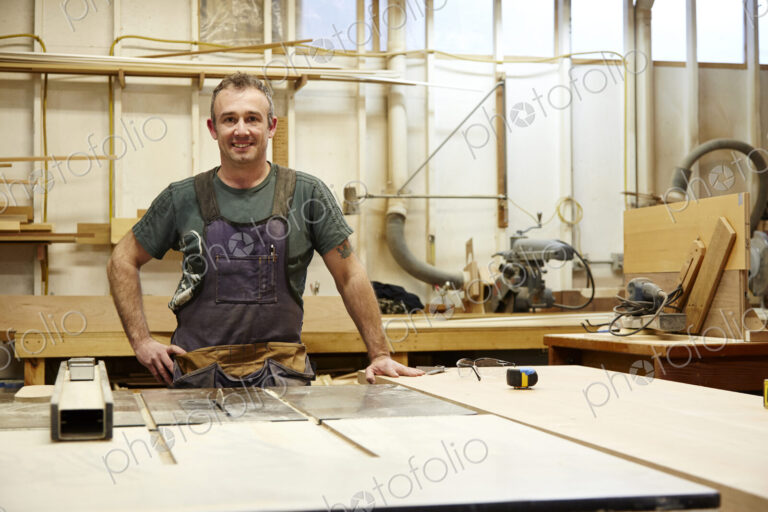 Carpenter smiling in workshop