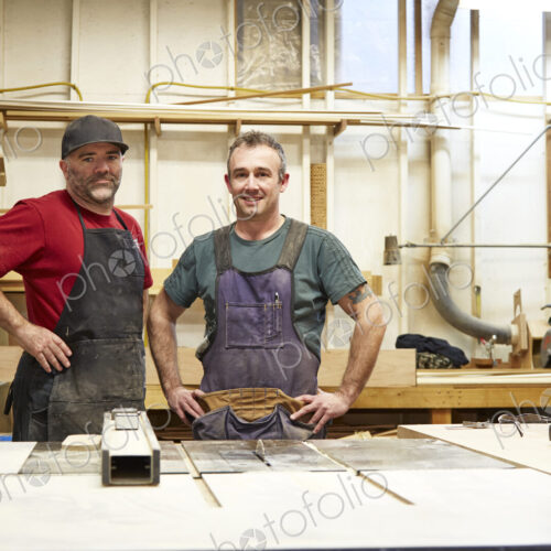 Carpenters smiling in workshop Carpenters smiling in workshop