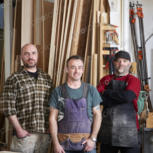 Carpenters smiling in workshop Carpenters smiling in workshop