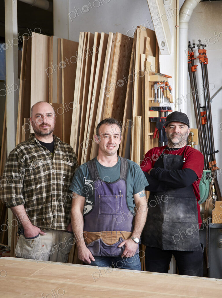 Carpenters smiling in workshop