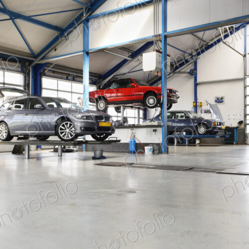 Cars Under Maintenance in empty Garage