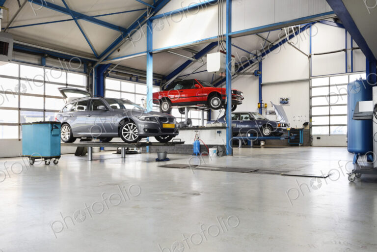 Cars Under Maintenance in empty Garage