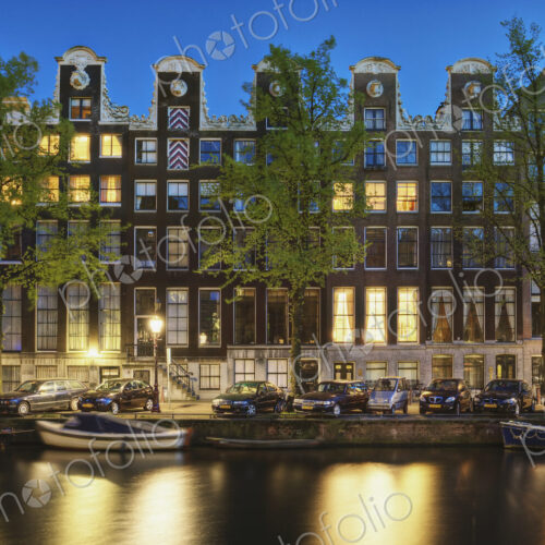 Cars and Canal-front Homes at Night