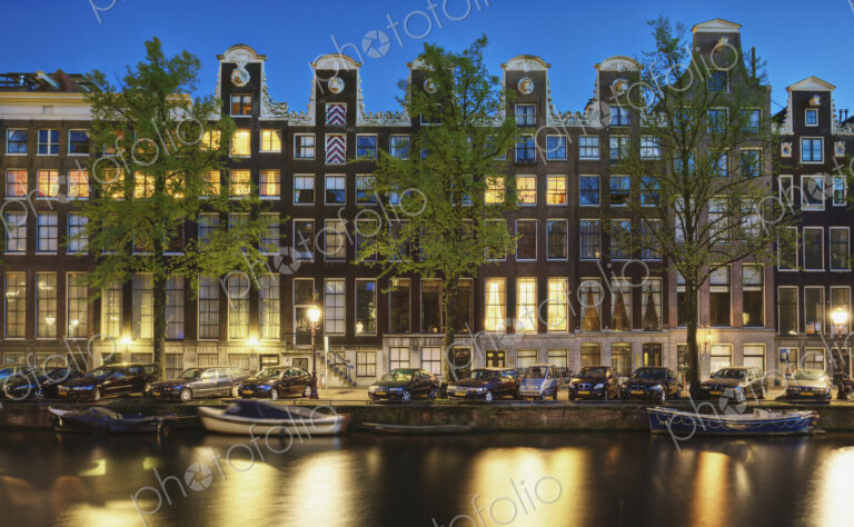 Cars and Canal-front Homes at Night