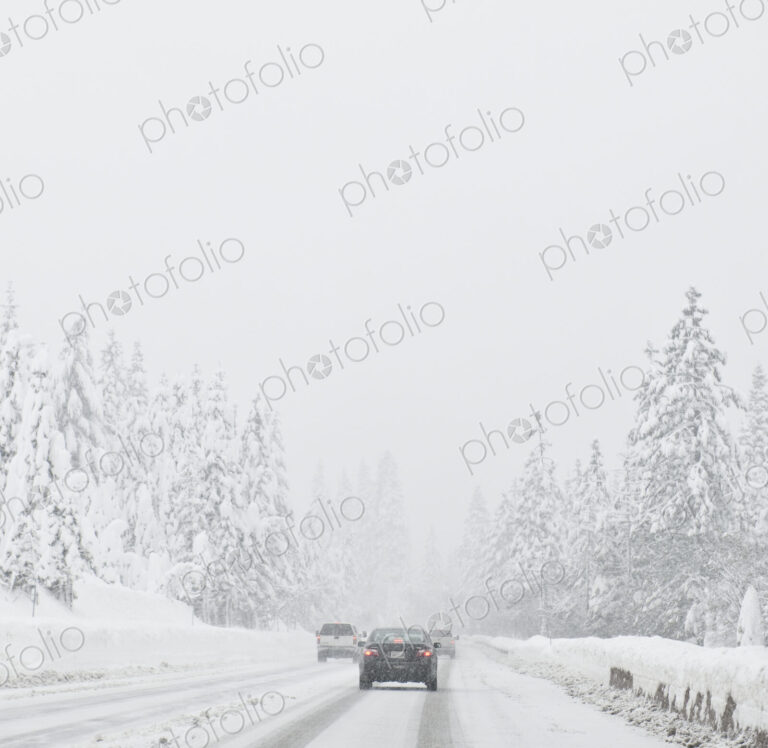 Cars driving on snow covered road