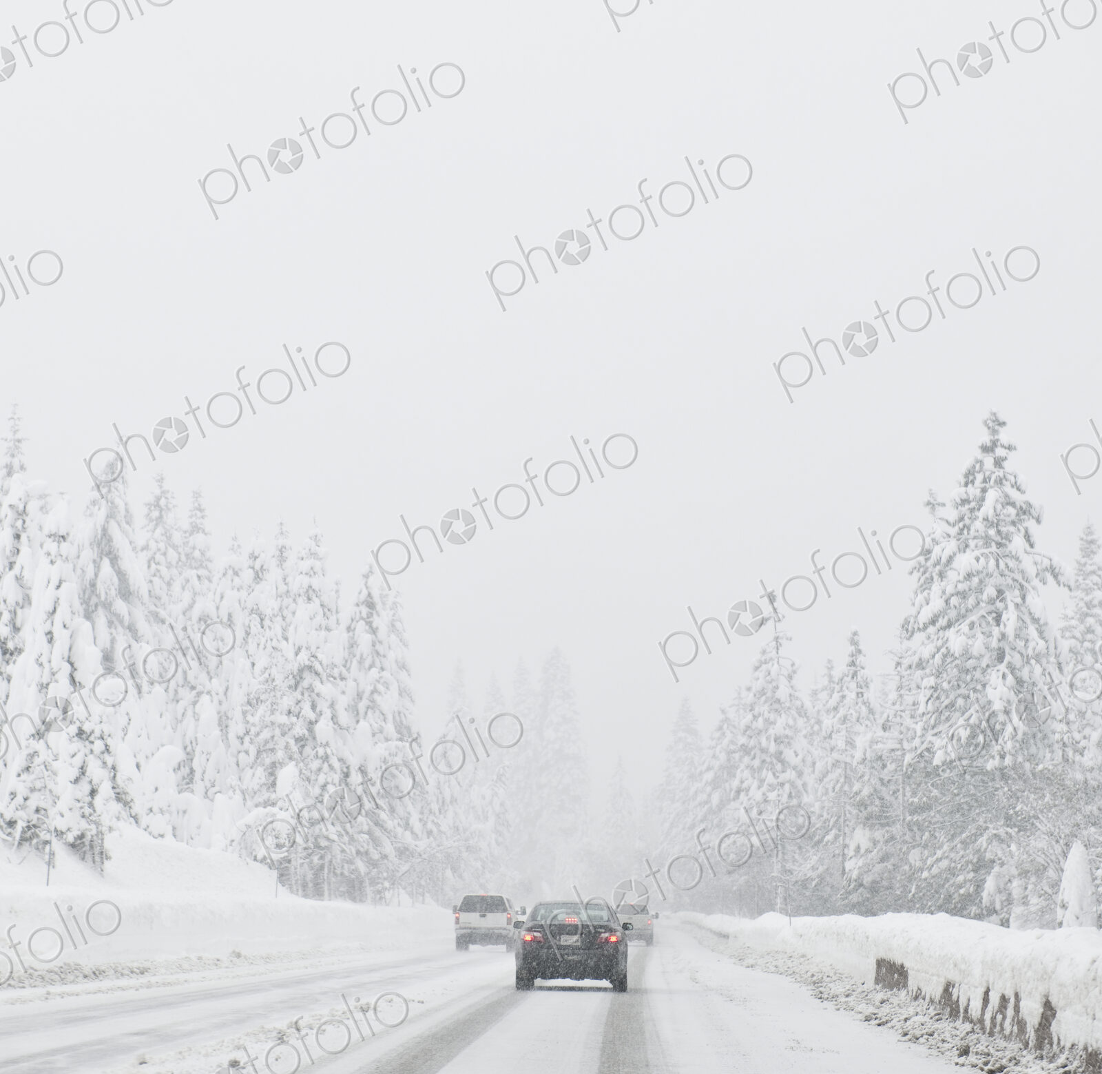 Cars driving on snow covered road