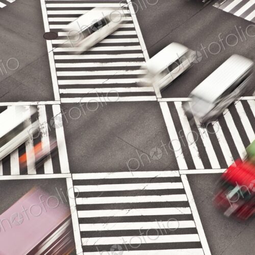 Cars driving through Shibuya Crossing intersection in Tokyo, Japan, view from above Cars driving through Shibuya Crossing intersection in Tokyo, Japan, view from above