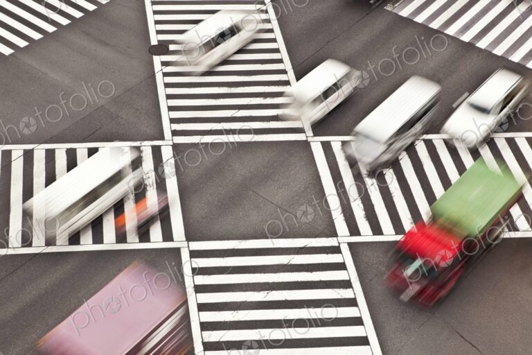 Cars driving through Shibuya Crossing intersection in Tokyo, Japan, view from above