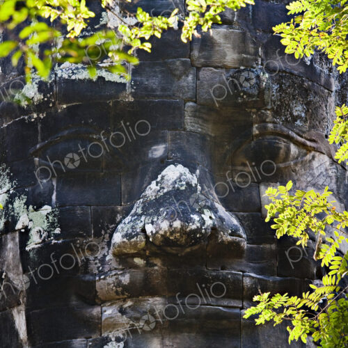 Carved stone face, Angkor, Cambodia