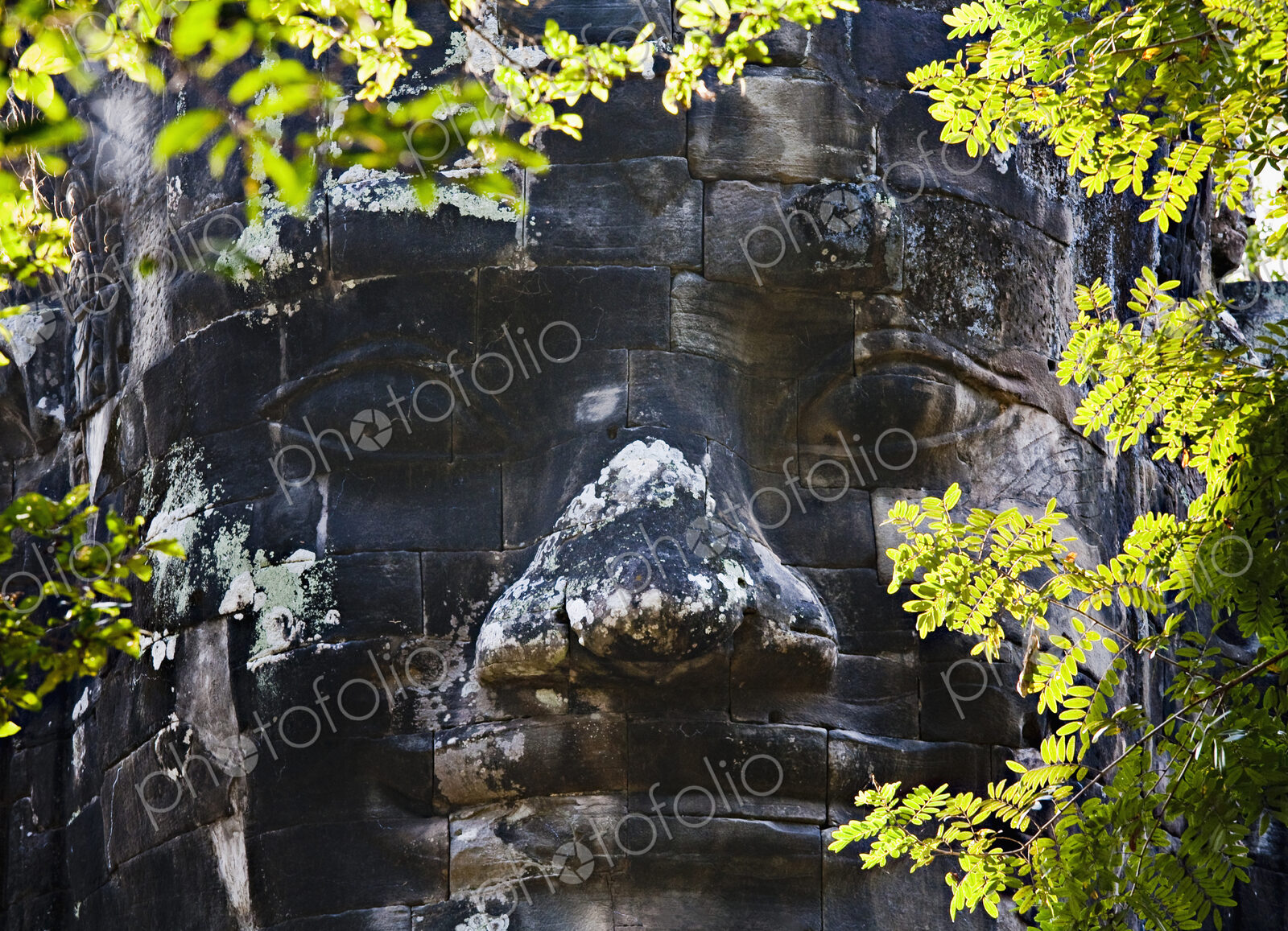 Carved stone face, Angkor, Cambodia
