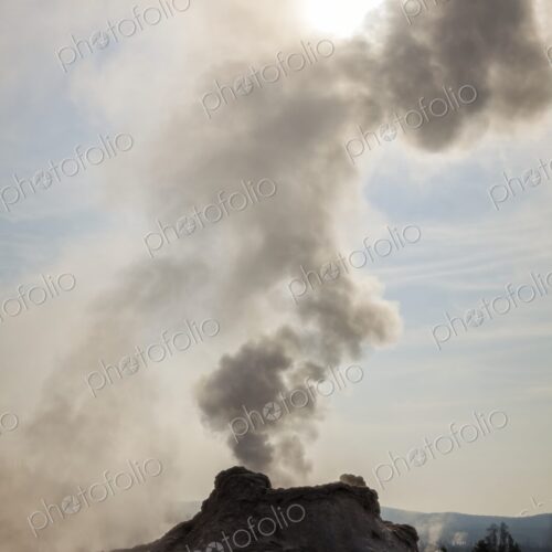 Castle Geyser in Yellowstone's Upper Geyser Basin releases thick steam against a… Castle Geyser in Yellowstone's Upper Geyser Basin releases thick steam against a…