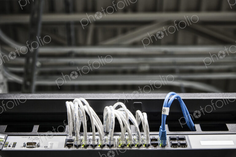 Cat 5 cables hooked to servers in a computer server farm.