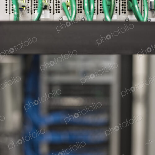 Cat 5 cables plugged into an individual server in a computer server farm. Cat 5 cables plugged into an individual server in a computer server farm.