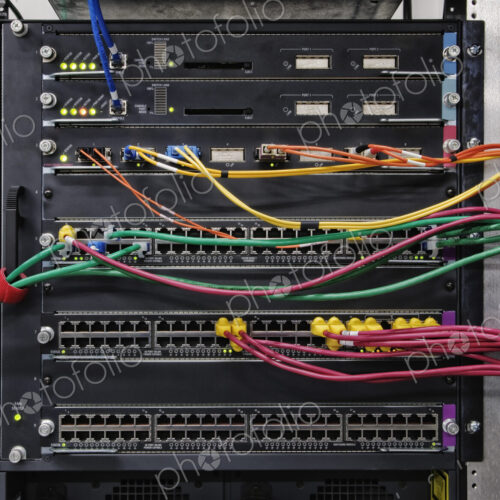 Cat 5 cables plugged into an individual server in a computer server farm. Cat 5 cables plugged into an individual server in a computer server farm.
