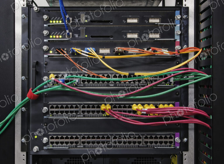 Cat 5 cables plugged into an individual server in a computer server farm.