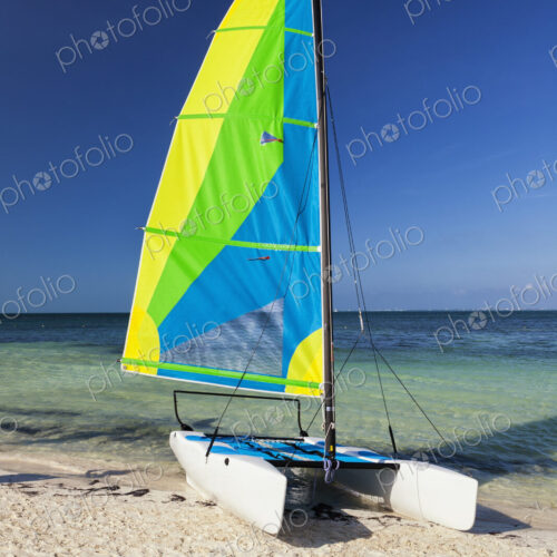 Catamaran sailing boat on the beach Catamaran sailing boat on the beach