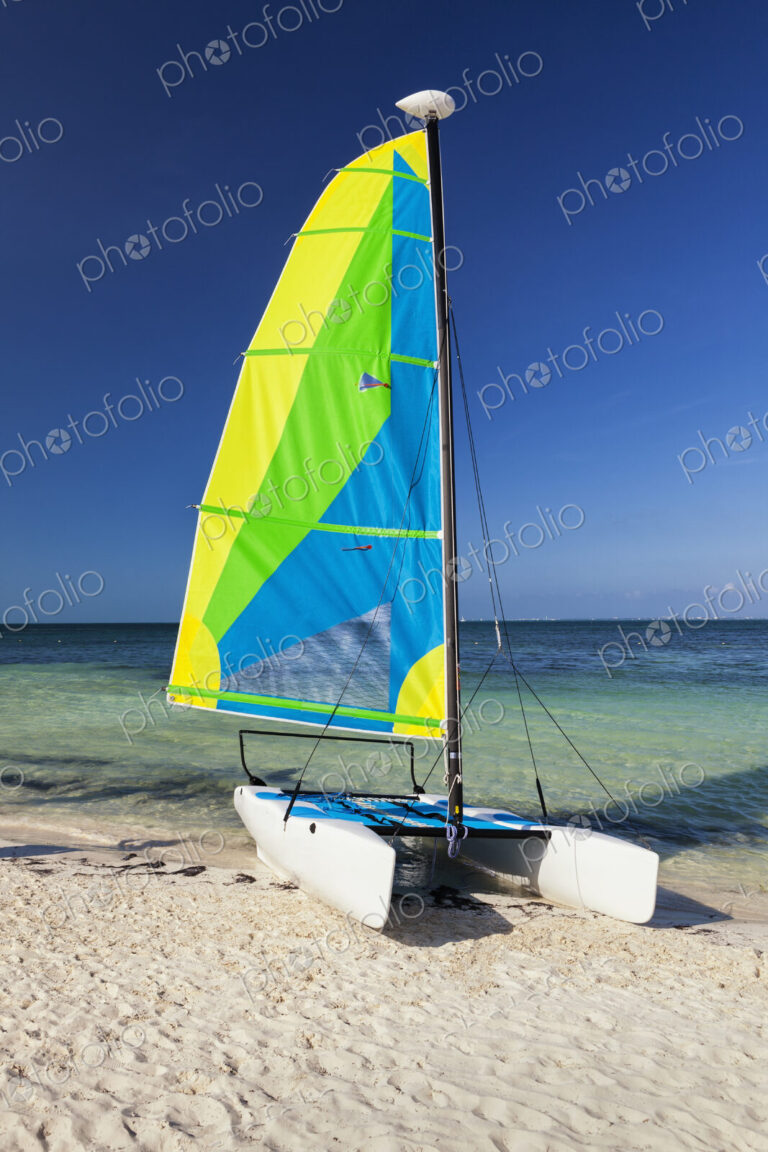 Catamaran sailing boat on the beach
