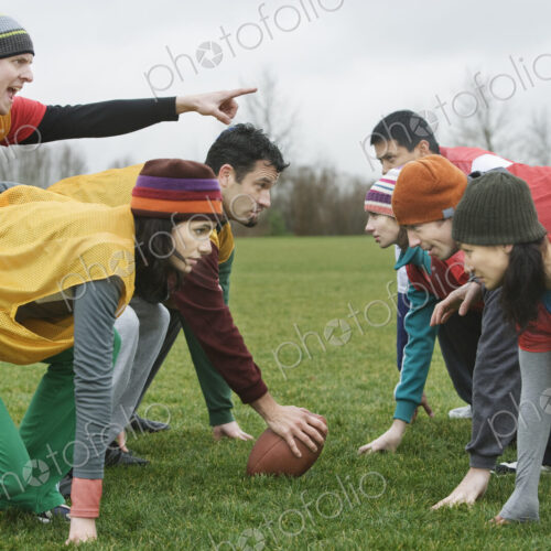 Caucasain man playing quarterback for an non-contact flag football team of friends. Caucasain man playing quarterback for an non-contact flag football team of friends.