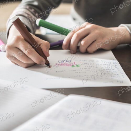 Caucasian boy drawing on paper Caucasian boy drawing on paper