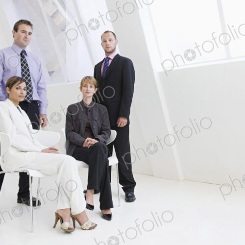 Caucasian business people posing in modern office