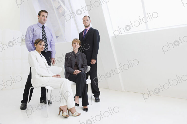 Caucasian business people posing in modern office