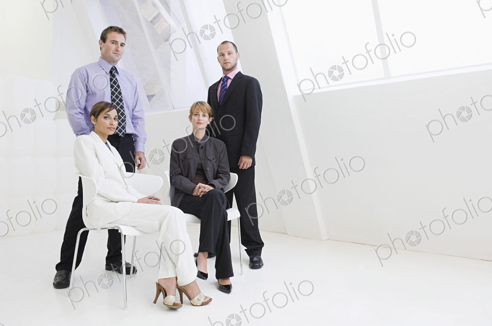 Caucasian business people posing in modern office