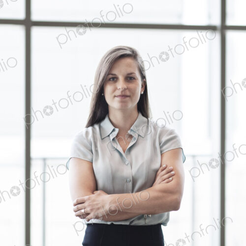 Caucasian business woman in a business center lobby. Caucasian business woman in a business center lobby.