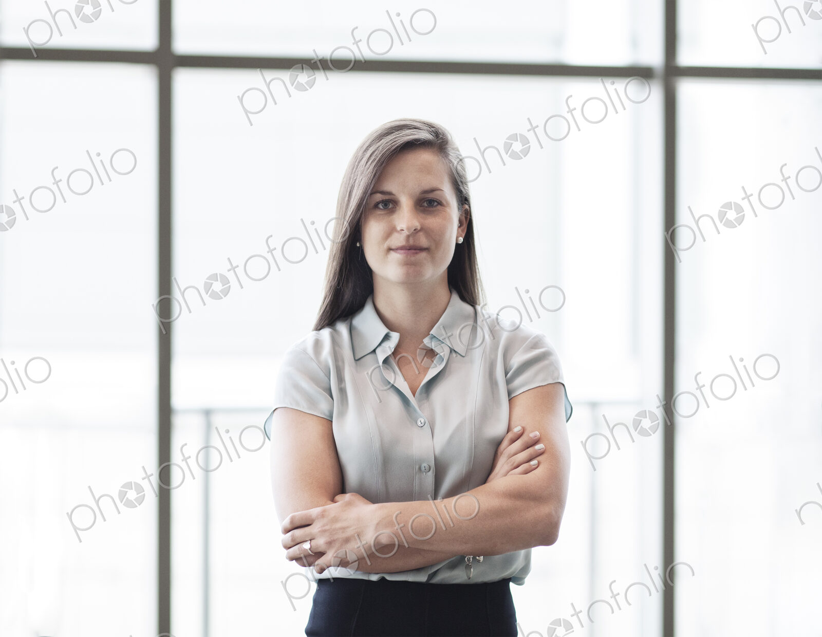 Caucasian business woman in a business center lobby.