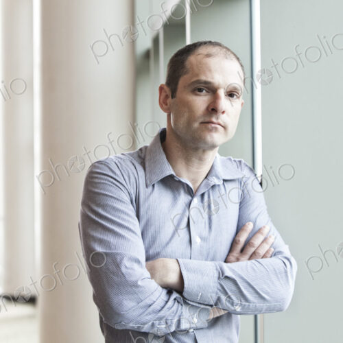 Caucasian businessman in a business center lobby. Caucasian businessman in a business center lobby.