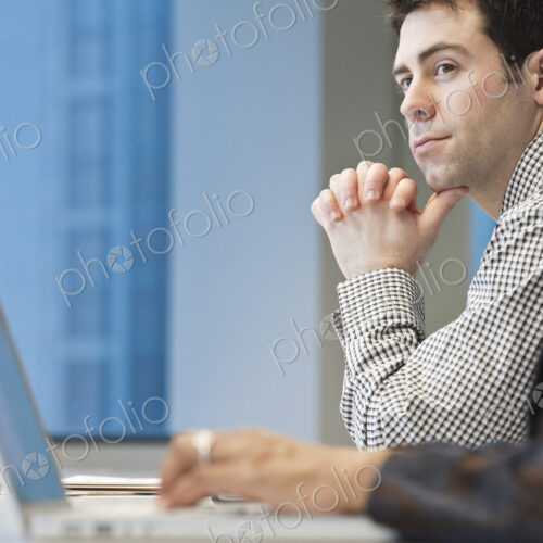 Caucasian businessman in a conference room setting. Caucasian businessman in a conference room setting.