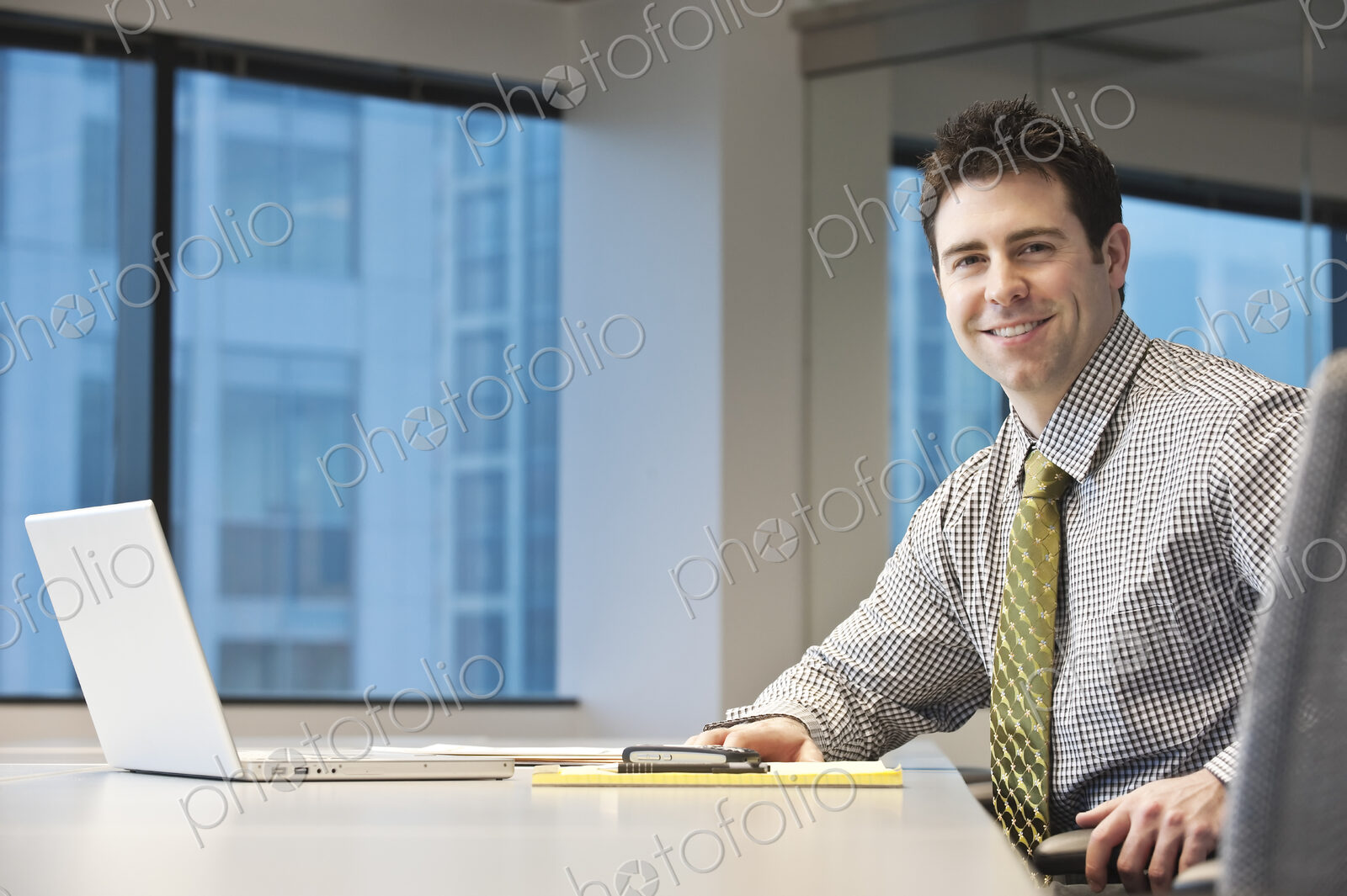 Caucasian businessman in a conference room setting.