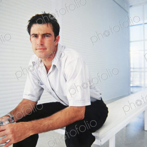 Caucasian businessman sitting in office Caucasian businessman sitting in office