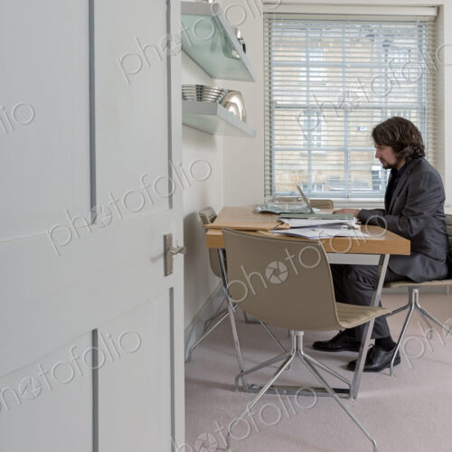 Caucasian businessman working at home office