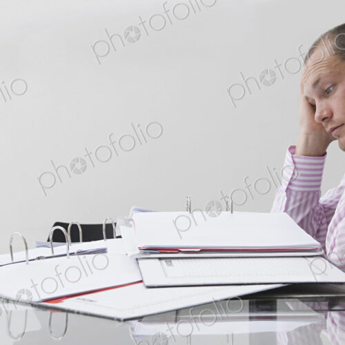 Caucasian businessman working in office Caucasian businessman working in office