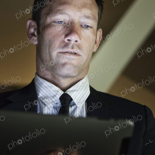 Caucasian businessman working on his notebook computer