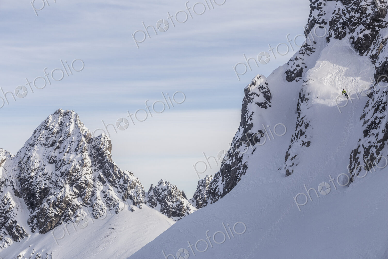 Caucasian climber scaling snowy mountain slope