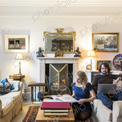 Caucasian couple hanging out in livingroom Caucasian couple hanging out in livingroom