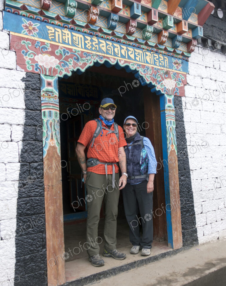 Caucasian couple standing in ornate doorway
