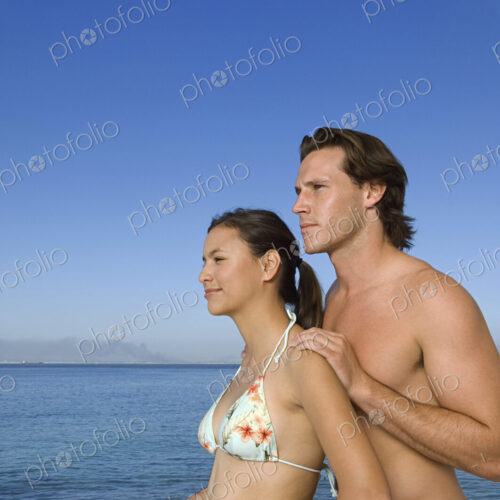 Caucasian couple standing on boat deck Caucasian couple standing on boat deck