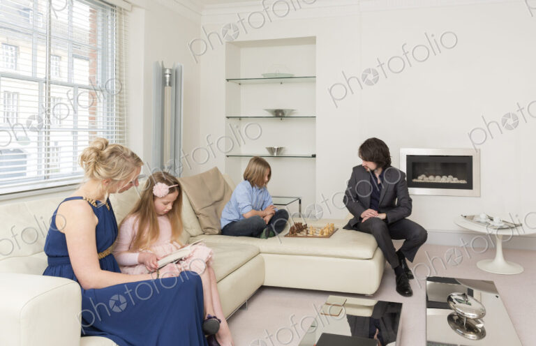 Caucasian family relaxing in living room