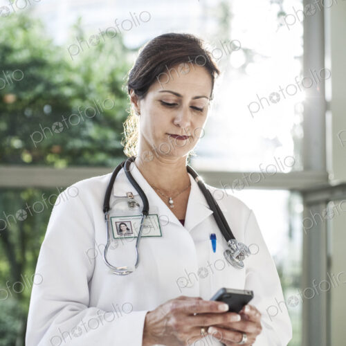 Caucasian female doctor in lab coat with stethescope. Caucasian female doctor in lab coat with stethescope.
