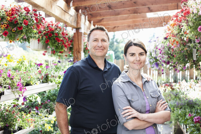 Caucasian man and woman owners of a small plant nursery.