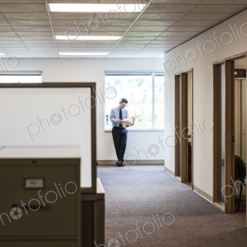 Caucasian man executive in office hallway